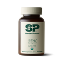 Image of E-Z Mg bottle next to tablets of magnesium supplements.