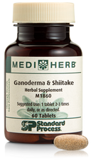 A bottle of Ganoderma & Shiitake herbal supplement next to a tablet.