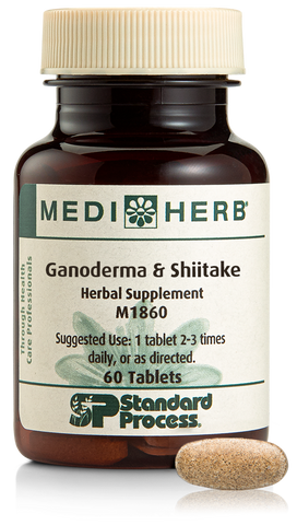 A bottle of Ganoderma & Shiitake herbal supplement next to a tablet.